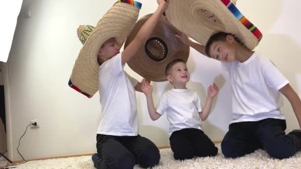 Three Boys Brothers Mexican Cowboy Hats Take Each Other Try — Stok video