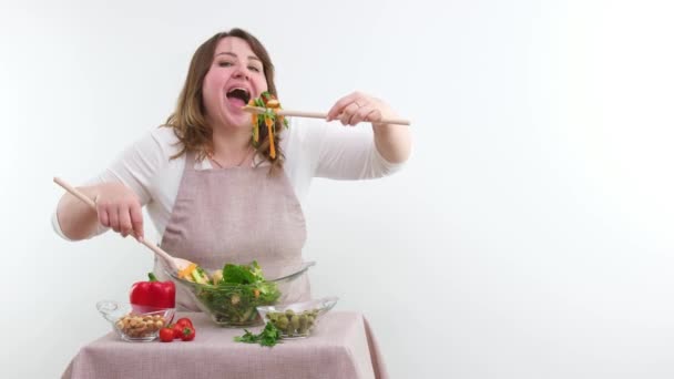 Funny Cheerful Woman Eating Salad White Background She Opens Mouth — Vídeos de Stock