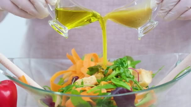 Cook Sterile Gloves Prepares Delicious Healthy Food Pour Dressing Salad — Stock video