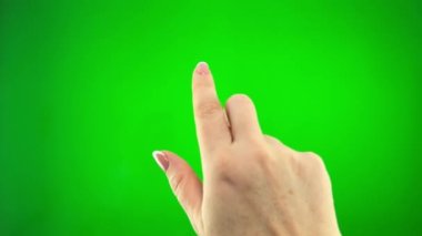Green background chromakey space for advertising text woman Finger clicks in places squeezes touchpad computer laptop technology touch screen