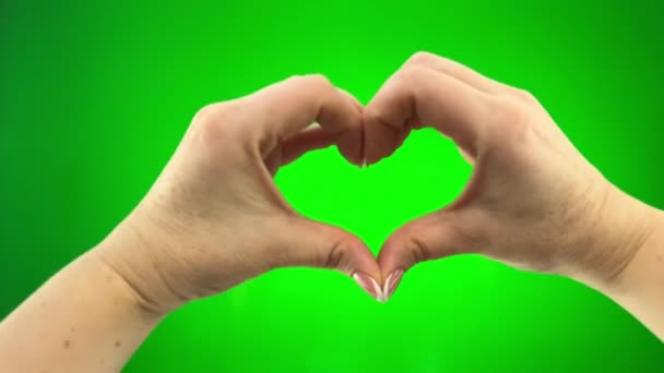 Female Hands Close Green Chromakey Background Show Heart Seems Beating — Vídeos de Stock