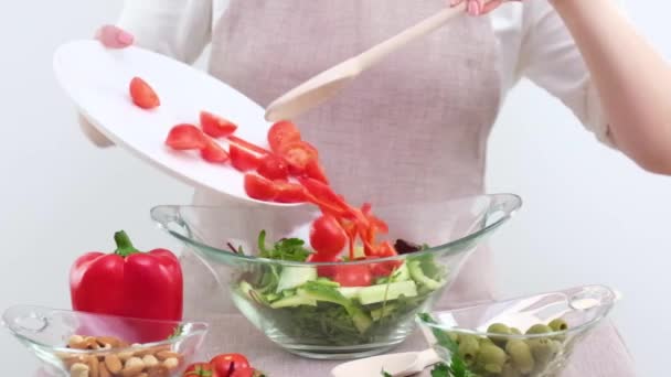 Girl Adds Sliced Cherry Tomatoes Vegetable Salad White Plate Wooden — Stockvideo