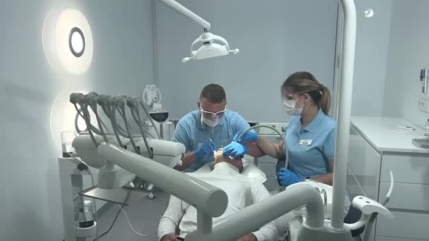 Doctor Blue Gloves Applies Ointment Patients Teeth Shows Cleaning Polishing — Video