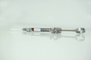 dental anesthesia metal syringe for dental clinics on a white background photography made in photo studio isolated on the white background. High quality photo