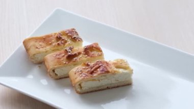 delicious cottage cheese dessert on white plate cottage cheese pie sprinkled with sesame seeds homemade pastries space for text static frame
