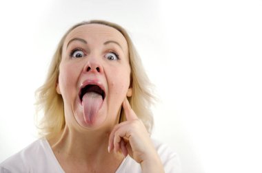 a woman shows her tongue healthy clean tongue result of cleaning the tongue. Female tongue with a white coating. isolated on white background. Gastrointestinal disease