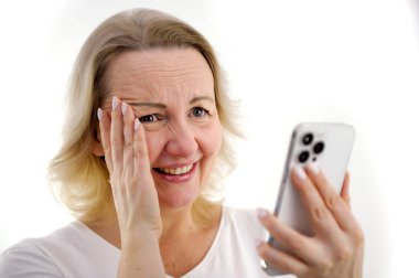 shy conversation over phone Photo of charming lovely lady short hairstyle hands hold telephone shy sincere smile share post like feed wear green shirt isolated white background