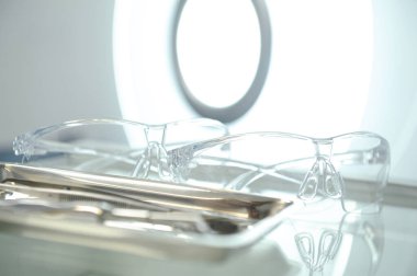 Banner dentists room office. Closeup different dental instruments and tools, blue toning. Dental Tools protective glasses