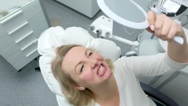 Beautiful Young Middle Aged Woman Admiring Herself Mirror Dental Chair — Video Stock