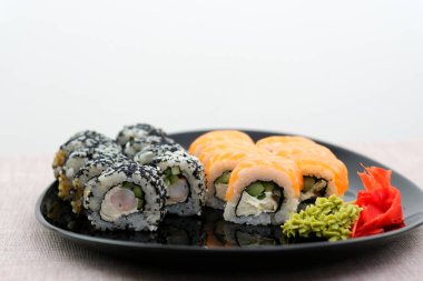 Rainbow Sushi Roll with salmon, eel, tuna, avocado, royal prawn, cream cheese Philadelphia, caviar tobica, chuka. Sushi menu. Japanese food. . High quality photo