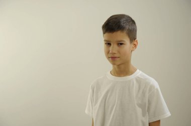 White T-shirt on a cute boy, isolated on white background. High quality photo