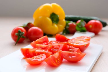 Delicious red tomatoes in Summer tray market agriculture farm full of organic. Fresh tomatoes, It can be used as background Chopped tomatoes on white background Ripe Tomatoes