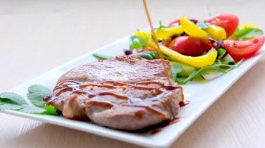 grilled meat with teriyaki sauce on rectangular white plate with salad serving restaurant shish kebab delicious food on the fire serving meat benefits pork beef drizzle with tereyaki sauce