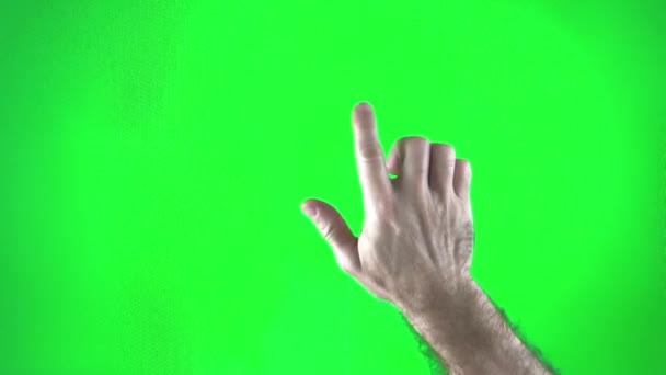 緑色の背景色の男が指を上げて見えないボタンを押すと強い男毛の手がボタンを2回と3回押す — ストック動画