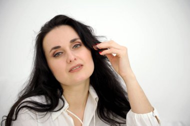 Beautiful gorgeous 40s mid aged mature woman looking at camera isolated on white. Mature old lady close up portrait. Healthy face skin care beauty, skincare cosmetics, cosmetology concept