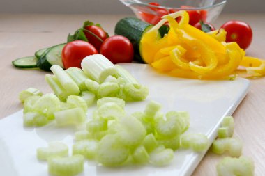 Sliced fresh celery or Celery stalk on cutting wooden board. High quality photo