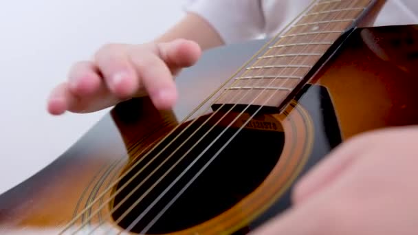 Close Childs Hands Guitar Boy Hits Strings Trying Play Study — Wideo stockowe