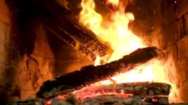 Cozy Relaxing Fireplace. TV Screen Saver. A Looping Clip of a Fireplace with Medium Size Flames Christmas Holidays Concept. Video for Meditation. High quality FullHD footage