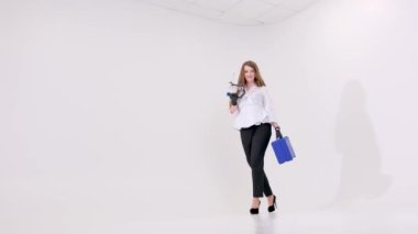 White studio lot of space for text female doctor walking space for text ad dental procedures false teeth prosthetics surgery artex system Amanngirrbach dental articulator in the hands of woman doctor