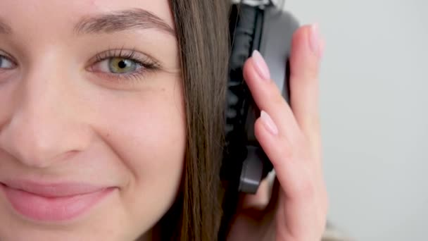 Closeup Portrait Lovely Young Woman Enjoying Music Using Headphones Isolated — Stockvideo