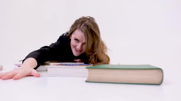 White Bright Studio Woman Lying Floor Crawling Books Pulling Books — Wideo stockowe