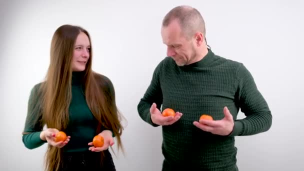 Man Woman Hold One Tangerine Each Hands Joking Putting Breasts — Stockvideo