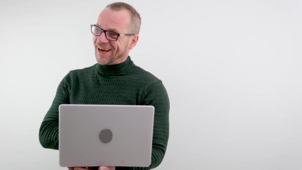 Middle Aged Man Balding Glasses Holding Laptop Joyful Fun Shows — Vídeo de stock