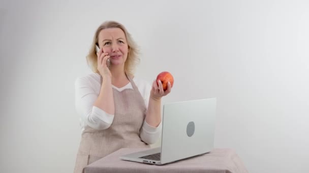 Adult Woman Housewife Prepares Food Children White Background Holds Apple — Video