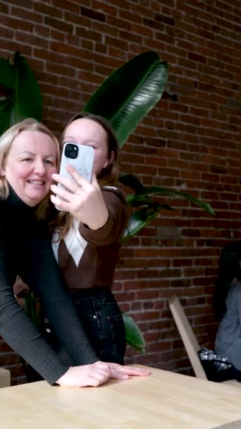 Mother Daughter Take Selfie Dark Cafe Brick Wall Smile Tenderness — Stock Video
