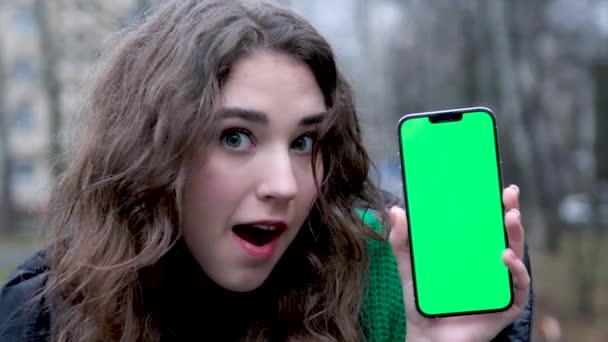 Closeup Portrait Young Charming Caucasian Female Holding Phone Pointing Green — Stock Video