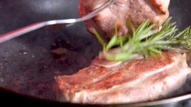 barbecue cutlets look very tasty cooked for a hamburger on a hot open fire on the grill turns over with a spatula after each turn the fire flares up and creates slow motion video for any restaurant.