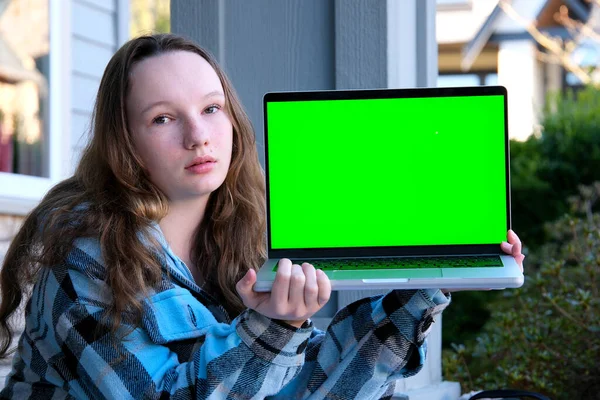 education school advertising entertainment internet games teen Girl show laptop with empty mockup green chroma key screen, It expert, technician repair service, tech support maintenance