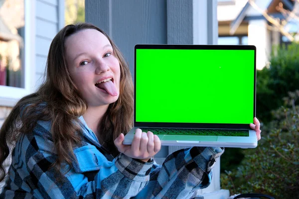 Teenage Girl Holding Laptop Green Monitor Hands Advertising Space Sitting — Stock Photo, Image