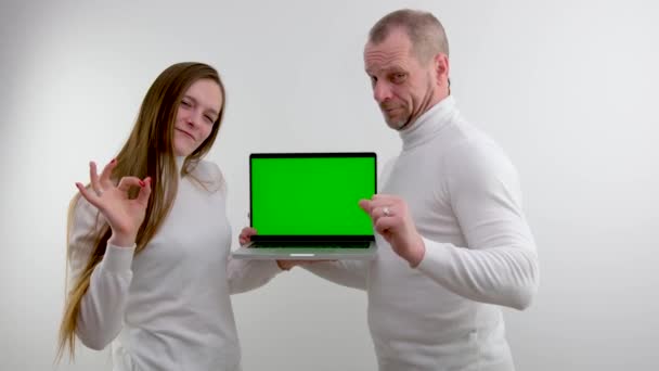 Man Girl Stand White Background Hands Laptop Green Blank Screen — Video Stock