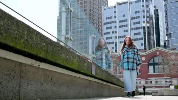 Teenage Girl Loose Hair Plaid Jacket Walks Canada Place Examines — Stock Video