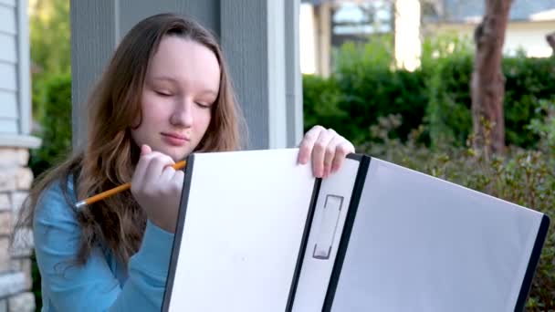 Teenage Girl Big White Folder Hands Crosses Out Something Pencil — Stock Video