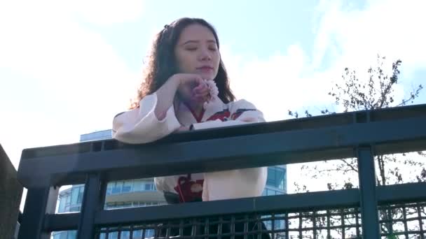 Beautiful Chinese Young Woman White Coat Holding Pink Cherry Blossoms — Stock Video