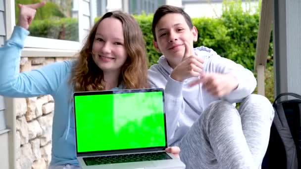 Popular Cool Photo Teens Holding Laptop Green Edge Chroma Key — Stock Video