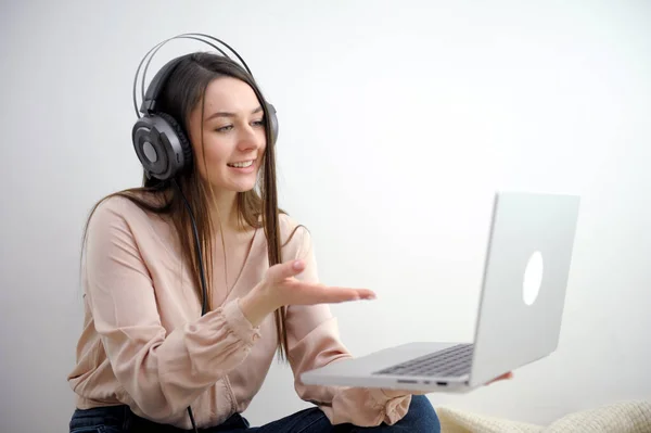 stock image Young satisfied fun happy successful employee business woman 20s she wearing casual yellow shirt hold use laptop pc computer sit work at wooden office desk with pc laptop. Achievement career