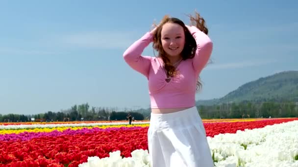 Beautiful Young Girl White Tulips Stands Smiling Adjusts Her Hair — Stock Video