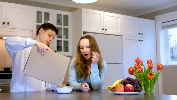 Boys Girl Teenagers Pour Cereal Plate Unrecognizable Boxes Kitchen Breakfast — Stock Video