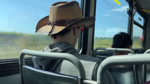 Man Hat Sits Bus Passing Field Cowboy Headdress Hooded Sweatshirt — Stock Video