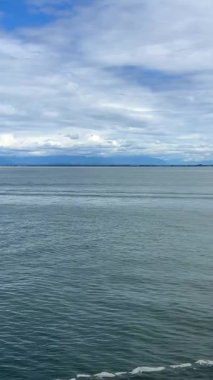 the view from the ship of the liner the ship is sailing and we will see only the Horizon all that we can see is movement background For text, divided in half Canada to Vancouver Island Ferry