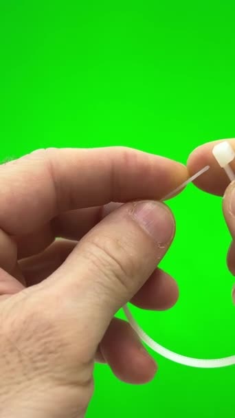 Green Background Chromakey Man Fastens Nylon Tie His Own Hands — Video Stock