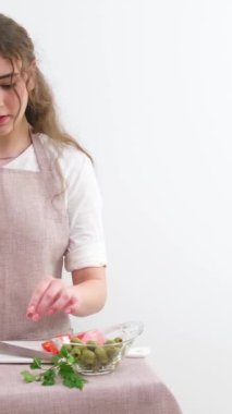 big board banner for advertising beautiful young woman prepares a vegetable salad in the kitchen. Healthy eating. Vegan salad. Diet. The concept of diet. Healthy lifestyle. We cook at home.