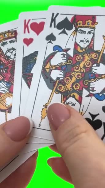 Hand Holding Four King Card Green Background Close Female Hands — Vídeo de stock