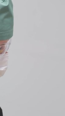 The doctor draws anesthesia into a syringe in yellow gloves Medical trainee learns how to do vaccinations. High quality 4k footage