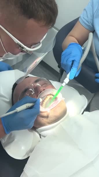 Doctor Blue Gloves Applies Ointment Patients Teeth Shows Cleaning Polishing — Stock video