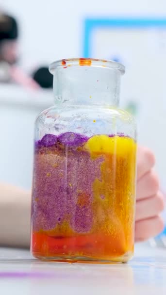 Close Glass Bottle Childrens Laboratory Chemical Experiments Lilac Orange Yellow — Wideo stockowe