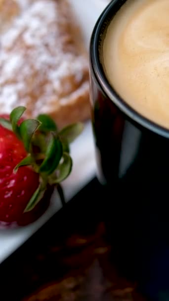 Big Black Cup Coffee Spoon Stirring Foam Strawberry Croissant White — Stock Video